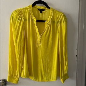 Cute highlighter, yellow blouse, long sleeve.